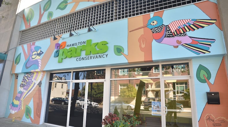 A nature-themed mural marks the entrance of the Hamilton Parks Conservancy office in downtown. Murals depicting birds native to Ohio will be painted in six Hamilton parks this summer. CONTRIBUTED