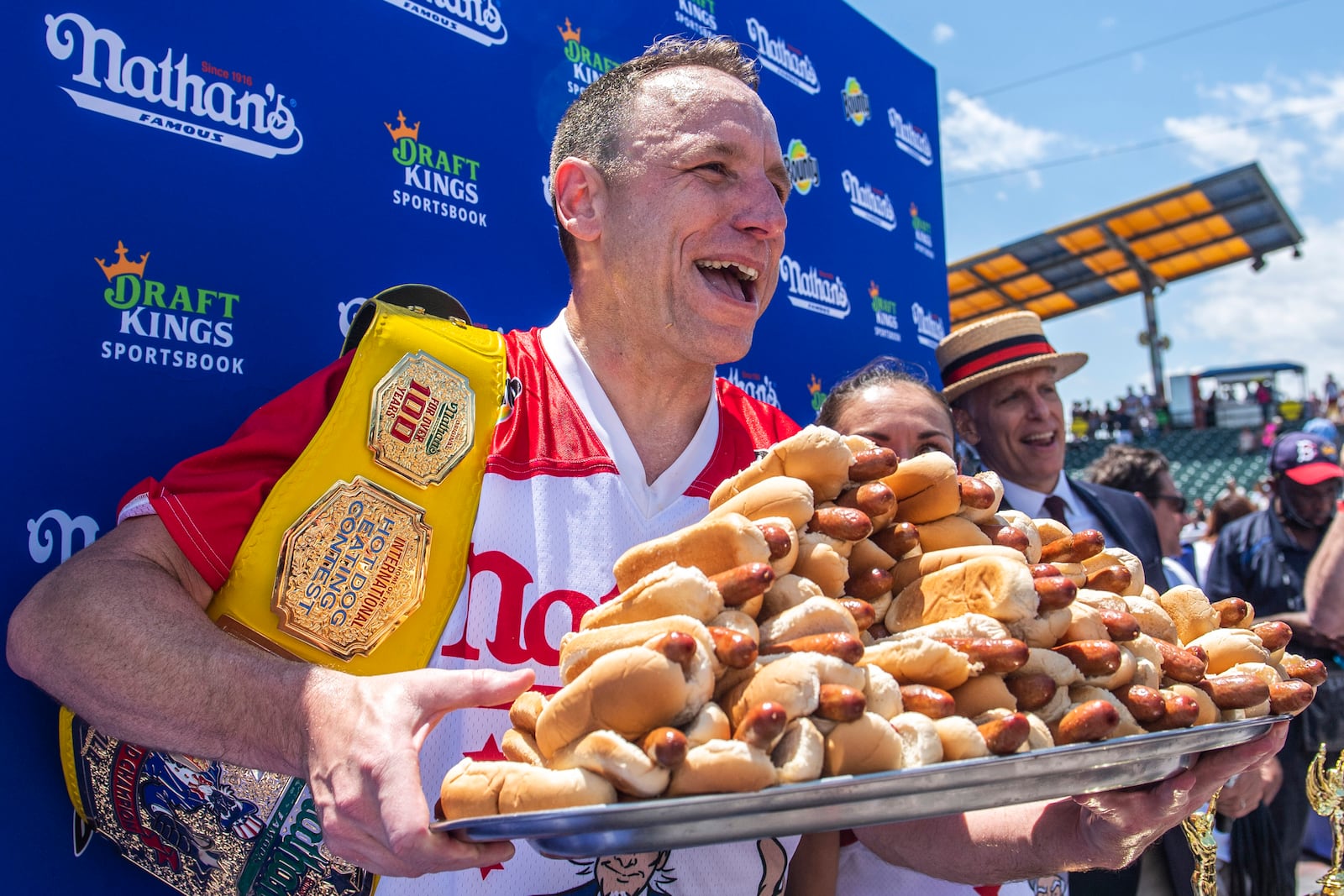 FILE - Joey Chestnut, winner of the 2021 Nathan's Famous Fourth of July International Hot Dog-Eating Contest, poses for photos in Coney Island's Maimonides Park, July 4, 2021, in the Brooklyn borough of New York. (AP Photo/Brittainy Newman, File)