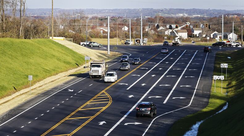 An intersection improvement construction project at the northern end of OH 4 Bypass and OH 4 in Fairfield Township is nearly complete as crews work on changing out traffic lights Tuesday, Nov. 30, 2021. The widening project added dual left and right turn lanes in some directions. NICK GRAHAM / STAFF