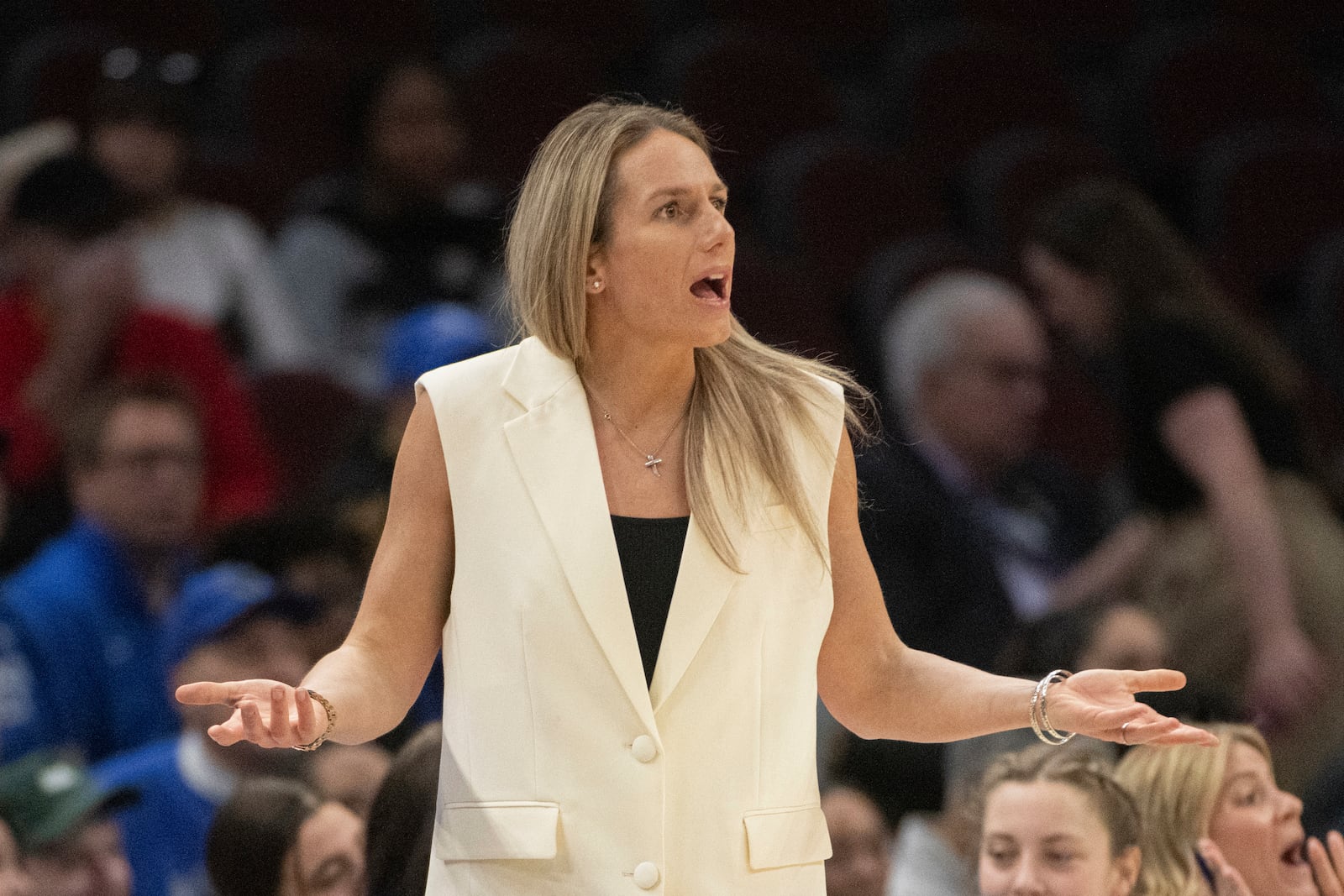 FILE - Buffalo's head coach Becky Burke reacts to a referee's call during the first half of an NCAA college basketball college game against Kent State in the championship of the Mid-American Conference tournament in Cleveland, March 16, 2024. (AP Photo/Phil Long, file)