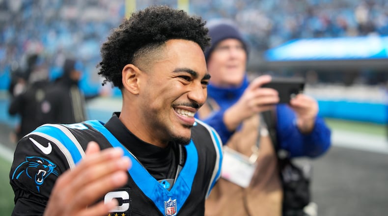 Carolina Panthers quarterback Bryce Young celebrates after an NFL football game between the Carolina Panthers and the Los Angeles Rams, Sunday, Nov. 30, 2025, in Charlotte, N.C. (AP Photo/Jacob Kupferman)