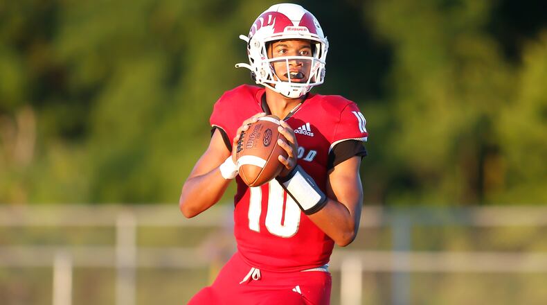 Trotwood-Madison High School quarterback Timothy Carpenter drops back to pass during their game against Alter on Thursday night in Trotwood. The Rams trailed by 10 points in the fourth quarter, but rallied to win 26-24. CONTRIBUTED PHOTO BY MICHAEL COOPER