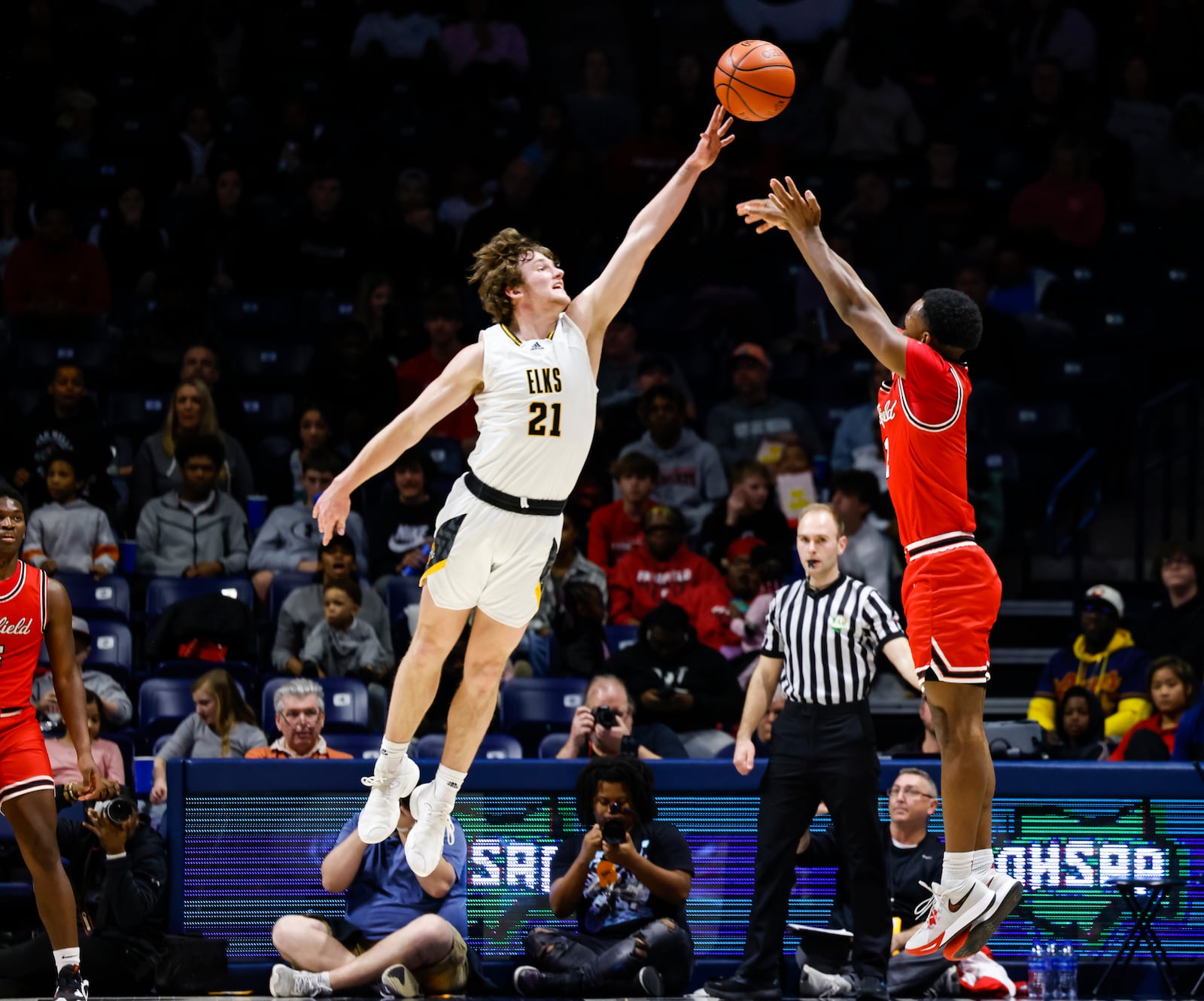 Fairfield's DeShawne Crim makes a three-point basket defended by Centerville's Kyle Kenney during their Division I regional final basketball game Saturday, March 11, 2023 at Xavier University's Cintas Center. Centerville won 64-53. Crim became Fairfield's all-time leading scorer during the game with a total of 1354 career points. NICK GRAHAM/STAFF