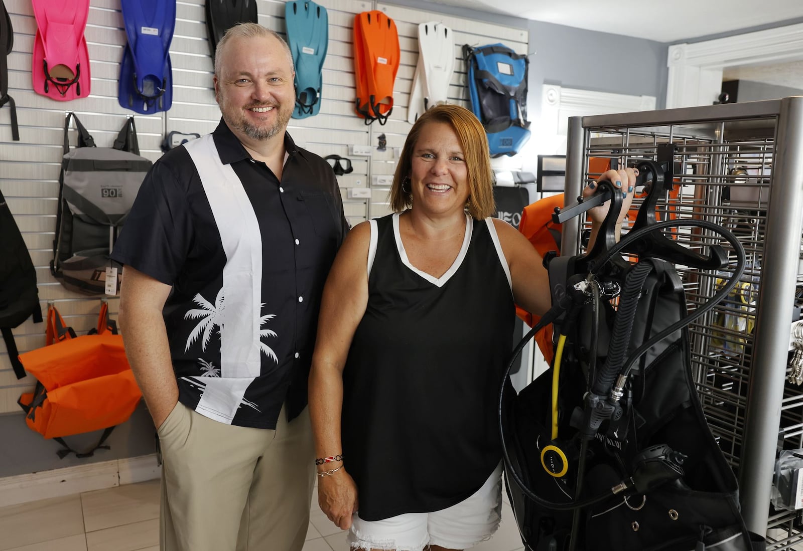 Nick Rakel and Robyn Winegardner are co-owners at Cincy Scuba in Hamilton. NICK GRAHAM/STAFF