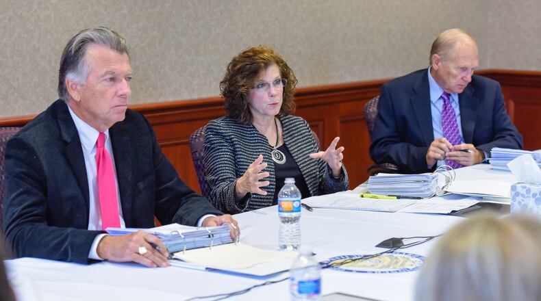 Butler County Commissioners T.C. Rogers, left, Cindy Carpenter and Donald Dixon sit in budget talks meetings Monday, Oct. 12 at the Butler County Government Services Center in Hamilton. NICK GRAHAM