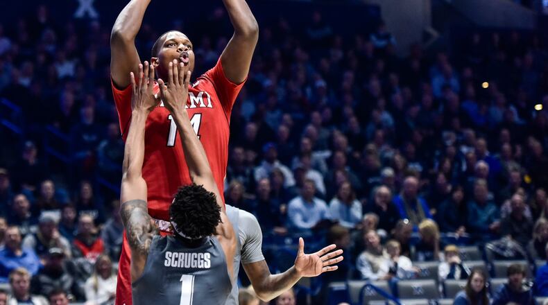 Miami’s Bam Bowman puts up a shot over Xavier’s Paul Scruggs during their basketball game Wednesday, Nov. 28, 2018, at Xavier’s Cintas Center in Cincinnati. Bowman scored 23 points Saturday in Miami’s win over Ohio. NICK GRAHAM/STAFF