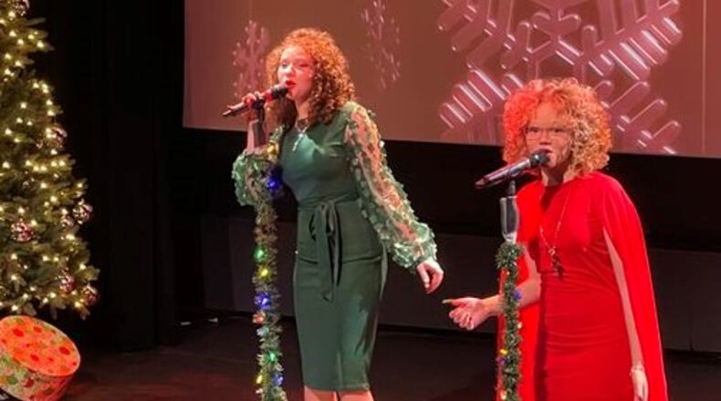 Macie Cunningham, left, and Marie Cunningham, right perform during "Christmas with The Cunninghams" at The Fitton Center in Hamilton on Dec. 19, 2021. The duo was on the latest season of NBC's "The Voice" on Team Kelly. MANDY GAMBRELL / STAFF