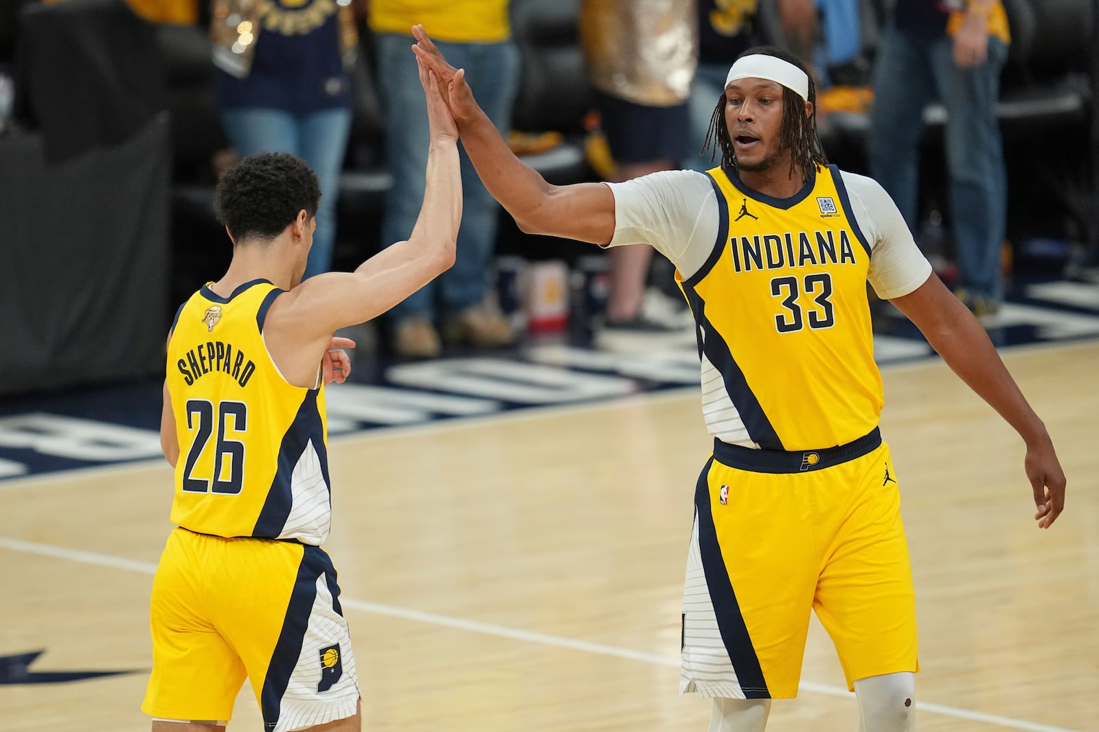 Indiana Pacers center Myles Turner (33) high fives guard Ben Sheppard (26) during the second half of Game 6 of the NBA Finals basketball series against the Oklahoma City Thunder, Thursday, June 19, 2025, in Indianapolis. (AP Photo/Michael Conroy)