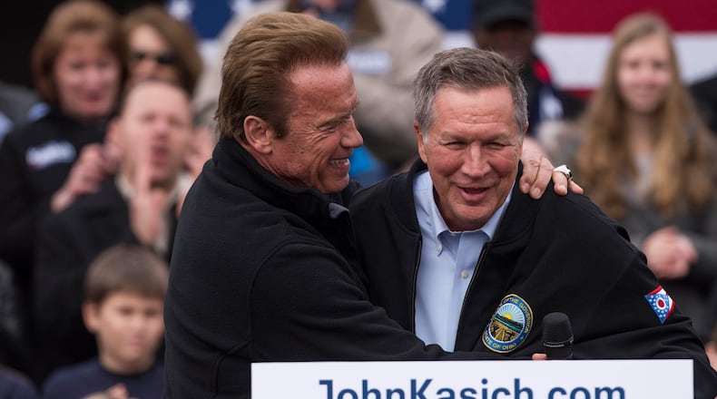 COLUMBUS, OH - MARCH 4: Ohio Republican Governor John Kasich is embraced by former California Governor Arnold Schwarzenegger before taking to the podium during a campaign rally at the Wells Barns at the Franklin Park Conservatory on March 6, 2016 in Columbus, Ohio. Arnold Schwarzenegger has endorsed Governor Kasich as the Republican Presidential candidate for the 2016 presidential election. (Photo by Ty Wright/Getty Images)
