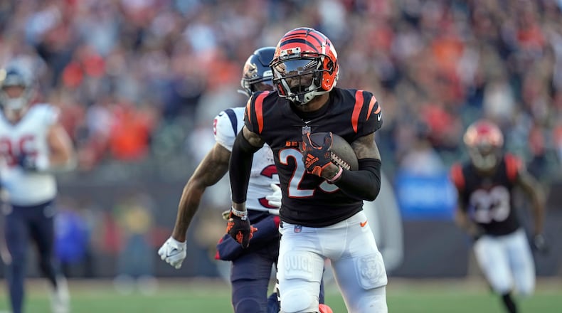 Cincinnati Bengals cornerback Cam Taylor-Britt (29) returns an interception against the Houston Texans during the second half of an NFL football game Sunday, Nov. 12, 2023, in Cincinnati. (AP Photo/Carolyn Kaster)