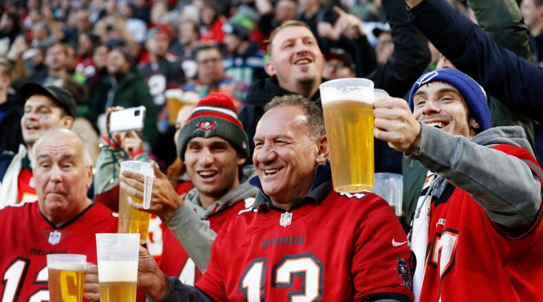 FILE - Fans cheer during an NFL football game between the Tampa Bay Buccaneers and the Seattle Seahawks at Allianz Arena in Munich, Germany, Nov. 13, 2022. (AP Photo/Steve Luciano, File)