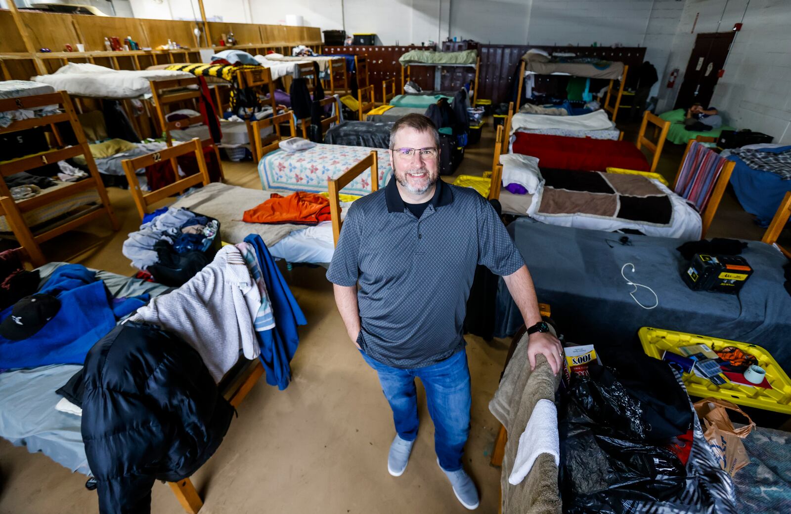 David Hood, executive director of Serve City, stands in their residential shelter on East Avenue in Hamilton Thursday, Nov. 11, 2021. Serve City offers several programs to serve homeless and low-income individuals and families in the area. NICK GRAHAM / STAFF