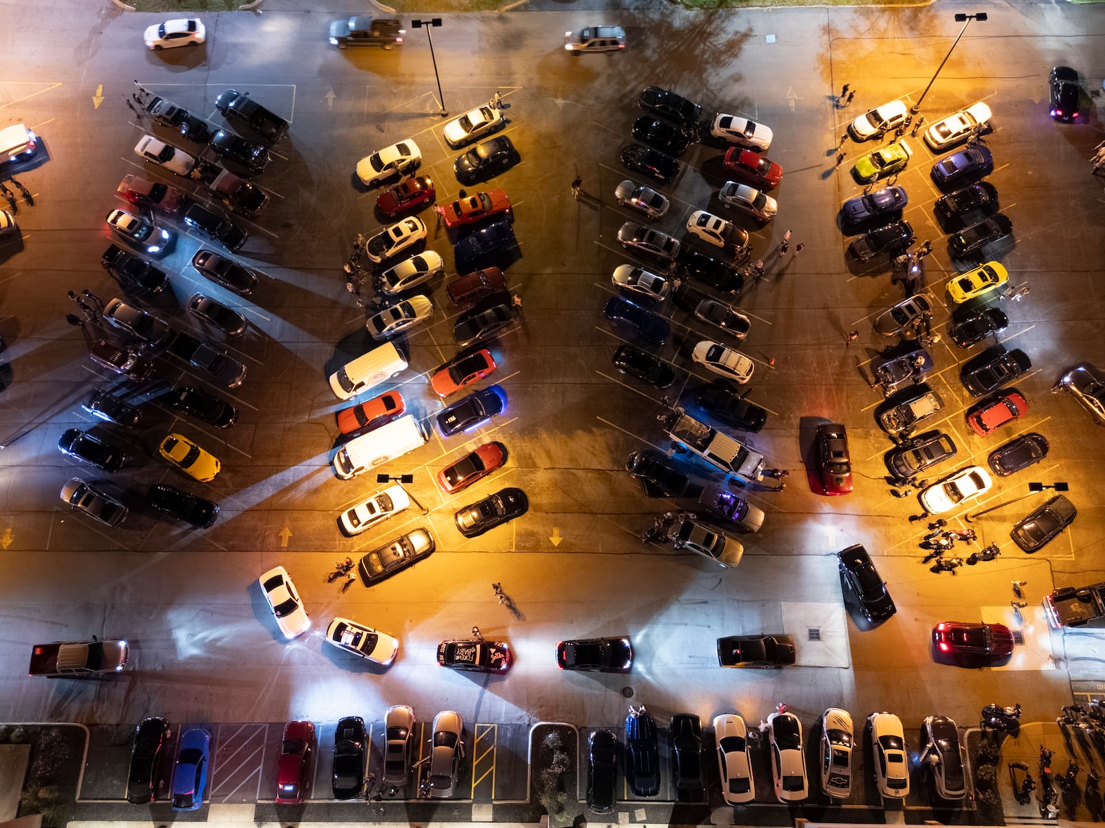 Car enthusiasts gather in a parking lot Saturday night on Roosevelt Blvd. in Middletown. NICK GRAHAM/STAFF