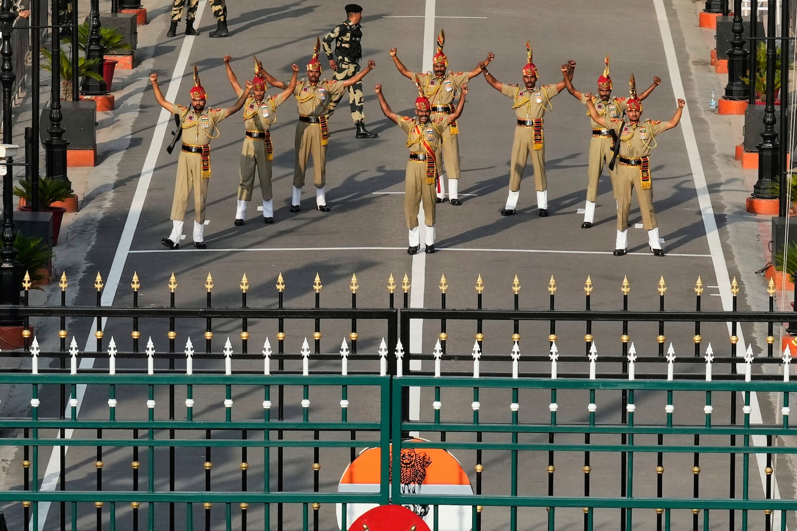 Indian Border Security Forces soldiers gesture during a daily closing ceremony at the Wagah, a joint post on the Pakistan and India border, near Lahore, Pakistan, Monday, May 5, 2025. (AP Photo/K.M. Chaudary)
