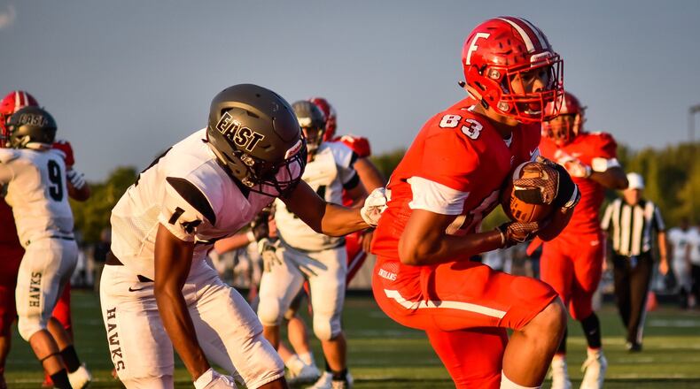 Fairfield’s Erick All carries the ball in for a touchdown while being trailed by Lakota East’s Brandon Britton during their Sept. 15, 2017, game at Fairfield Stadium. The host Indians won 48-14. NICK GRAHAM/STAFF