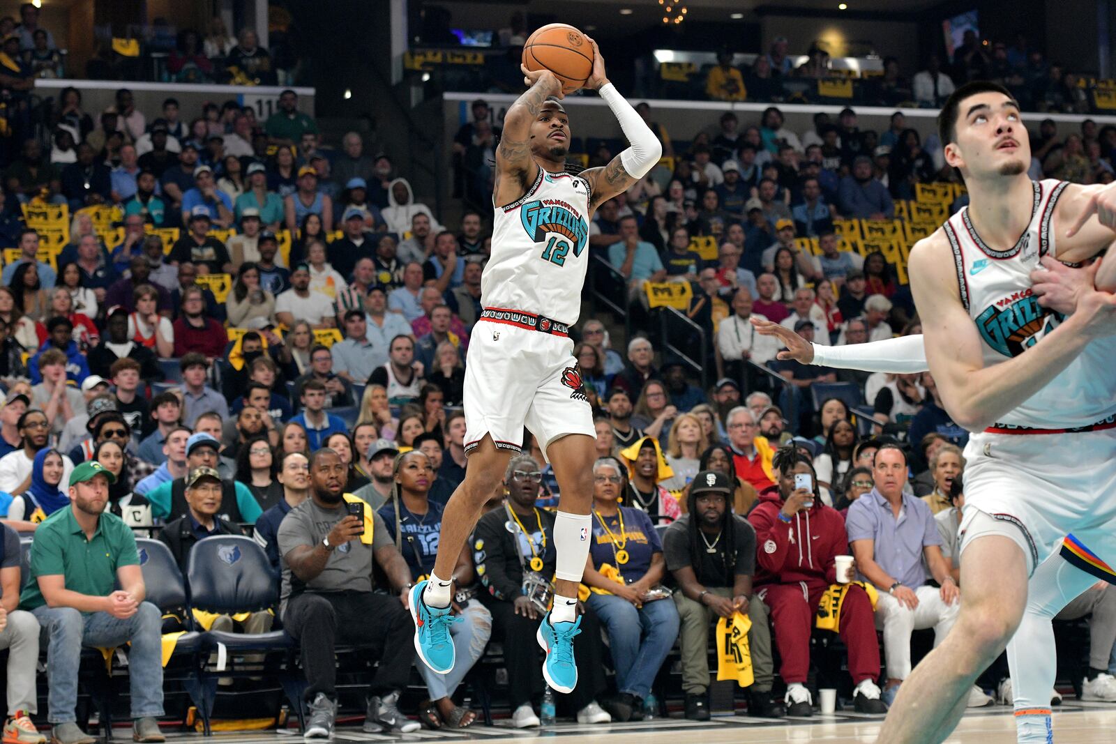 Memphis Grizzlies guard Ja Morant (12) shoots against the Oklahoma City Thunder in the first half of Game 3 of an NBA first-round playoff series Thursday, April 24, 2025, in Memphis, Tenn. (AP Photo/Brandon Dill)