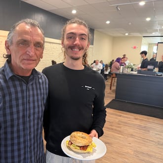 Early Berds Cafe & Coffee owner Logan Fitzwater (right) and his grandfather, Dave Uhl (left) pose for a photo at the new business at 202 N. Third St. in Hamilton. The breakfast and brunch restaurant serves American cuisine and aims to create a European café vibe. ERIC SCHWARTZBERG/STAFF