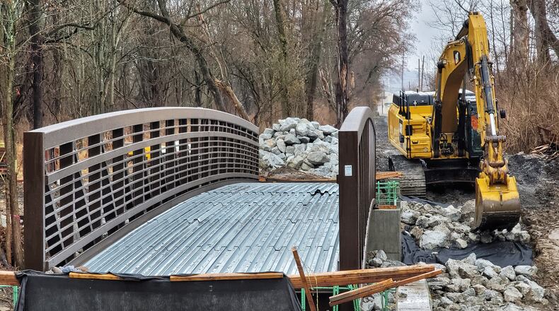 A bridge has been set in place over Two Mile Creek for the Hamilton Beltline project for bicycle and pedestrian traffic that will run between Eaton Ave. and Cleveland Ave. in Hamilton. NICK GRAHAM / STAFF