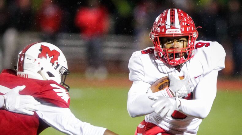 Fairfield’s Jutahn McClain carries the ball during their Division I playoff football game against Milford Friday, Nov. 2 at Milford High School. Milford won 39-35 to advance. NICK GRAHAM/STAFF