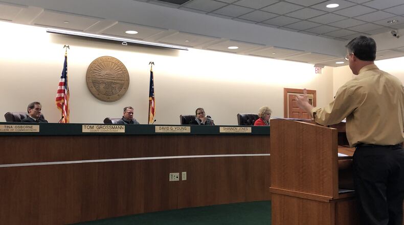 Sanitation Engineer Chris Brausch talks with Warren County commissioners about a $10 million sewer plant project. The commissioners held up support for the financing plan on Tuesday. STAFF/LAWRENCE BUDD