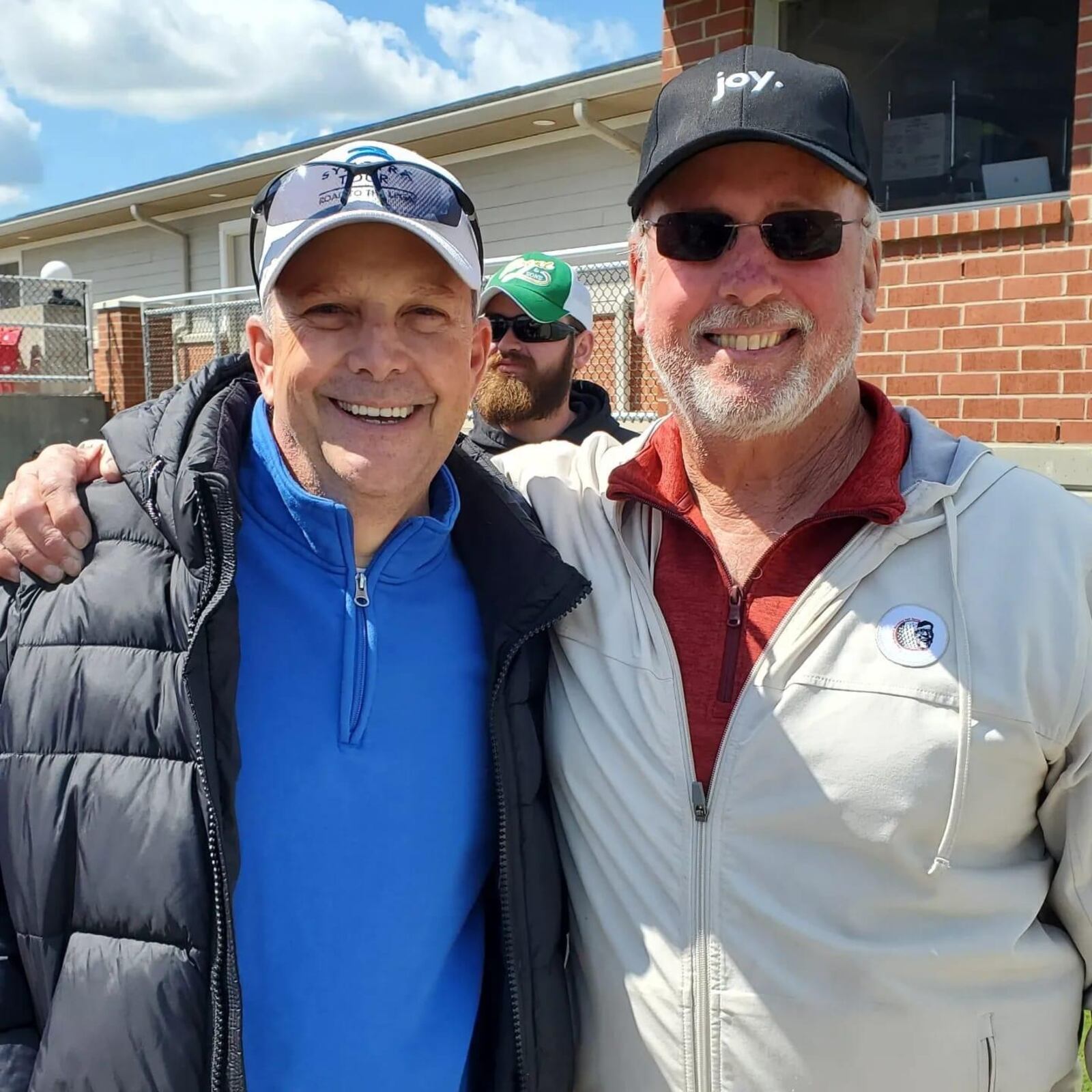 WLW's Lance McAlister, left, will serve as grand marshal for this year's Joe Nuxhall Miracle League Opening Day Parade Saturday in Fairfield. On the right is Kim Nuxhall, president of the foundation. SUBMITTED PHOTO