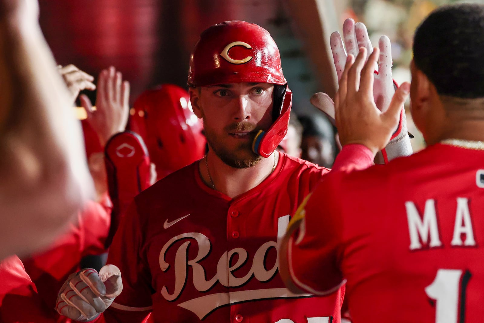 Cincinnati Reds' Tyler Stephenson celebrates in the dugout after hitting a three-run home run during the fourth inning of a baseball game against the Athletics Saturday, Sept. 13, 2025, in West Sacramento, Calif. (AP Photo/Sara Nevis)