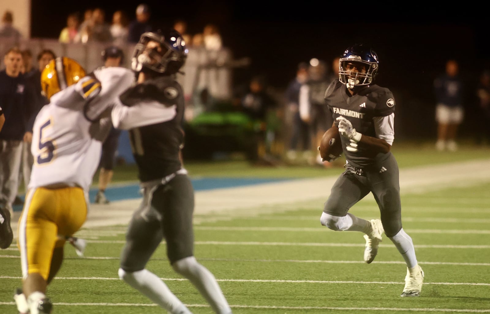 Fairmont's Damien Pattin runs against Springfield on Friday, Oct. 17, 2025, at Roush Stadium in Kettering. David Jablonski/Staff