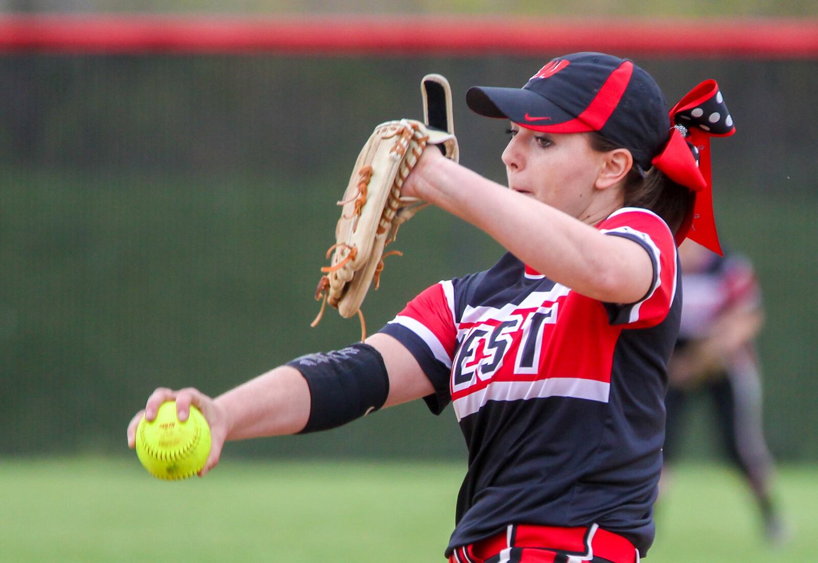 Lakota West pitcher Megan Brankamp (13) deals to the plate during Tuesday’s game against Lakota East at West. GREG LYNCH/STAFF