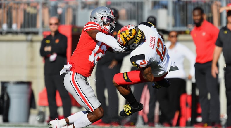 Ohio State’s Denzel Ward hits Maryland’s Taivon Jacobs after a reception in the first quarter at Ohio Stadium on October 7, 2017 in Columbus, Ohio. Ward was ejected from the game after being assessed a targeting penalty for the hit. (Photo by Jamie Sabau/Getty Images)