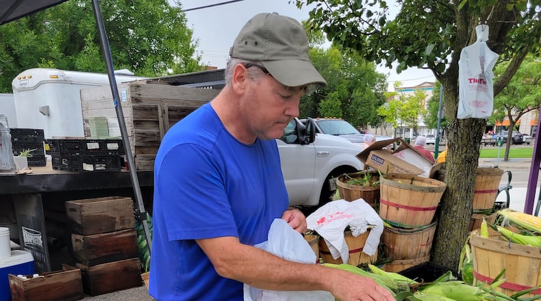 Downing Fruit Farm sells corn at the oxford Farmers Market. CONTRIVUTED