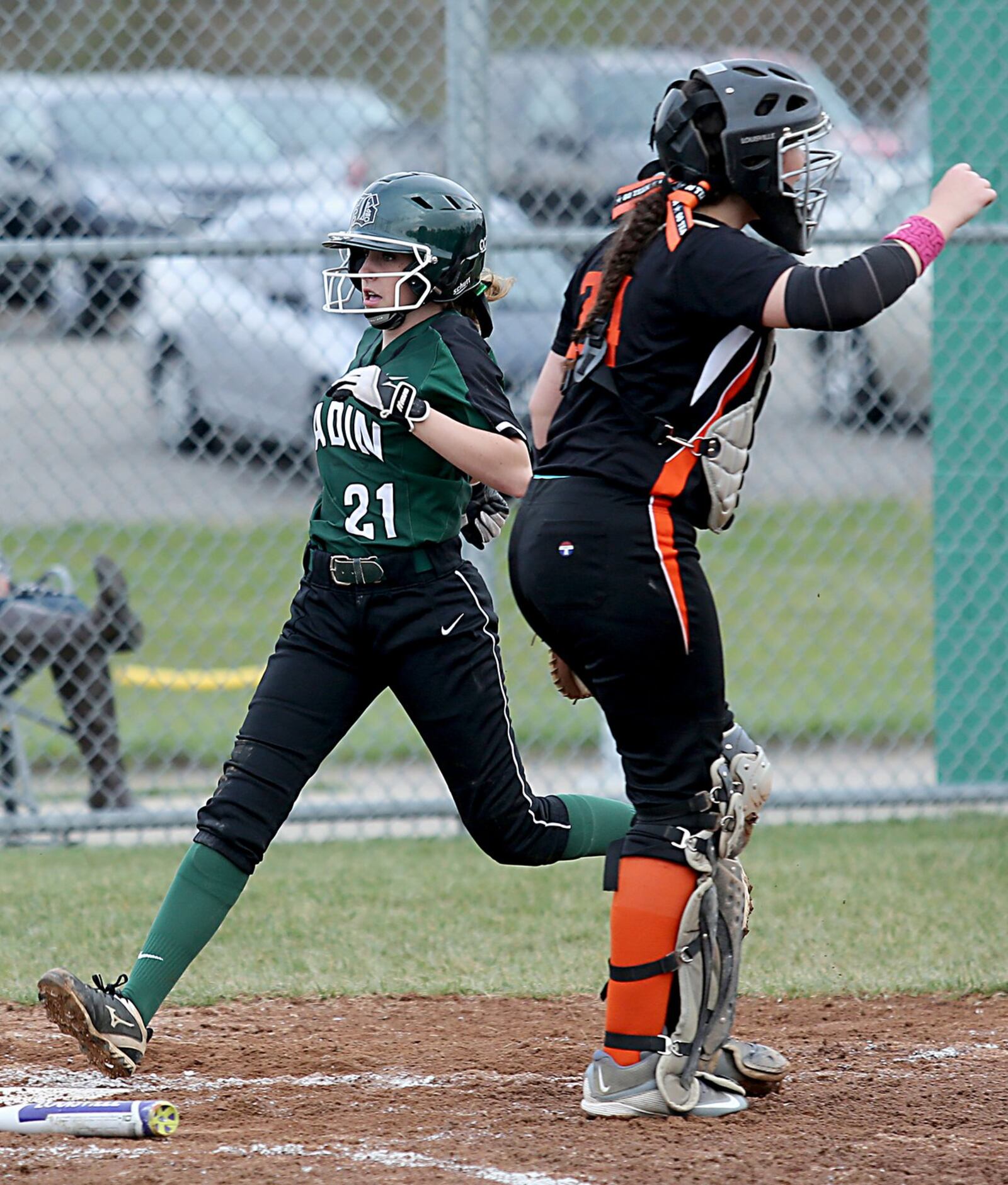 Badin’s Gracie McHugh scores as Wilmington catcher Hunter Toller waits for the throw during their game at Mueller Stadium in Hamilton on Monday. CONTRIBUTED PHOTO BY E.L. HUBBARD