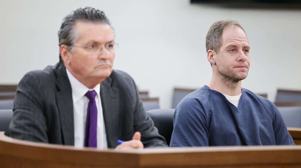 Caleb Flynn listens during an arraignment hearing on Thursday, March 19, 2026, in Miami County Common Pleas Court in Troy. He is seated next to his attorney, L. Patrick Mulligan. BRYANT BILLING / STAFF
