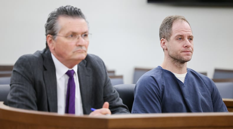 Caleb Flynn listens during an arraignment hearing on Thursday, March 19, 2026, in Miami County Common Pleas Court in Troy. He is seated next to his attorney, L. Patrick Mulligan. BRYANT BILLING / STAFF