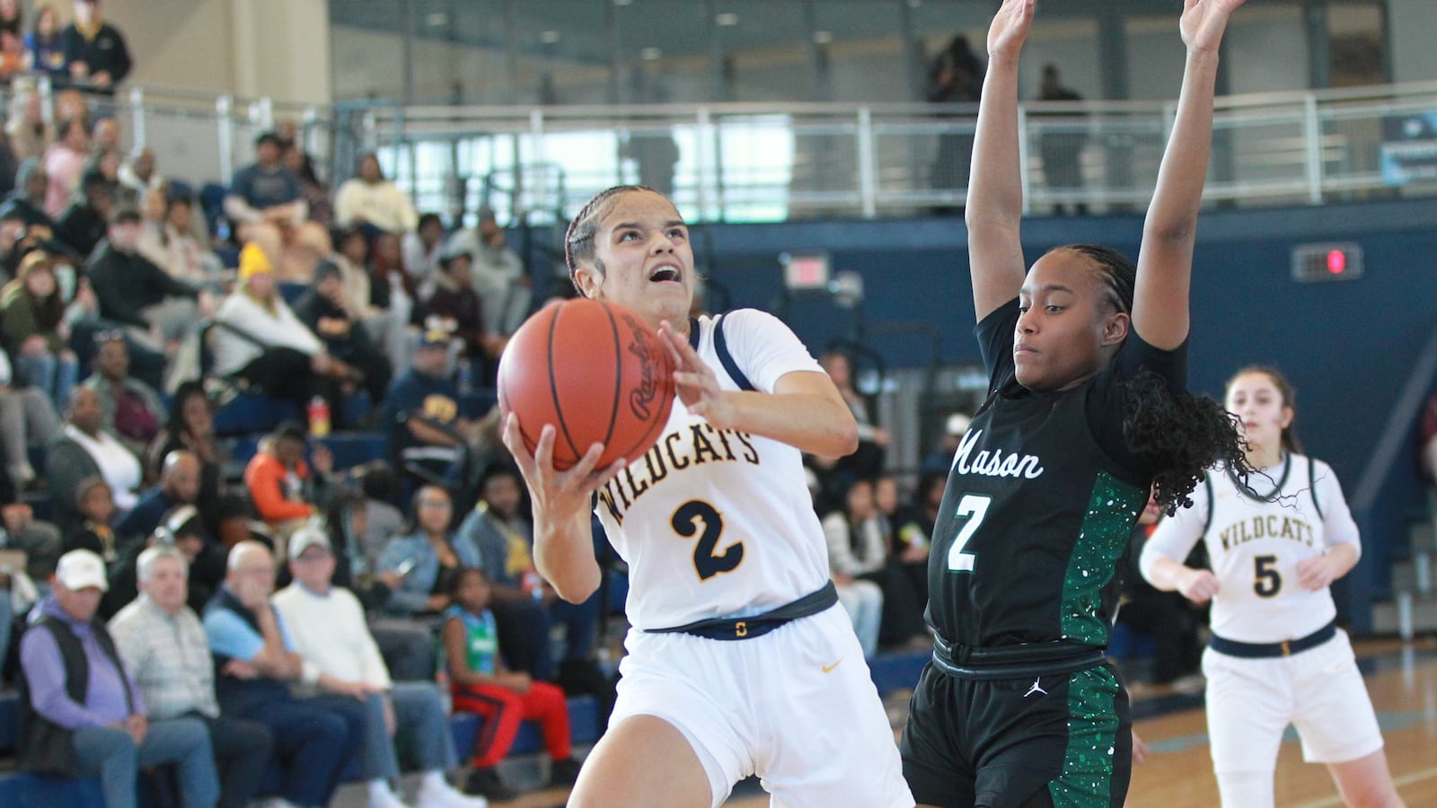 Springfield High School guard Milly Portis drives to the basket during their Division I girls basketball district final against Mason on Feb. 22, 2025 at Fairborn High School. MARCUS HARTMAN / STAFF