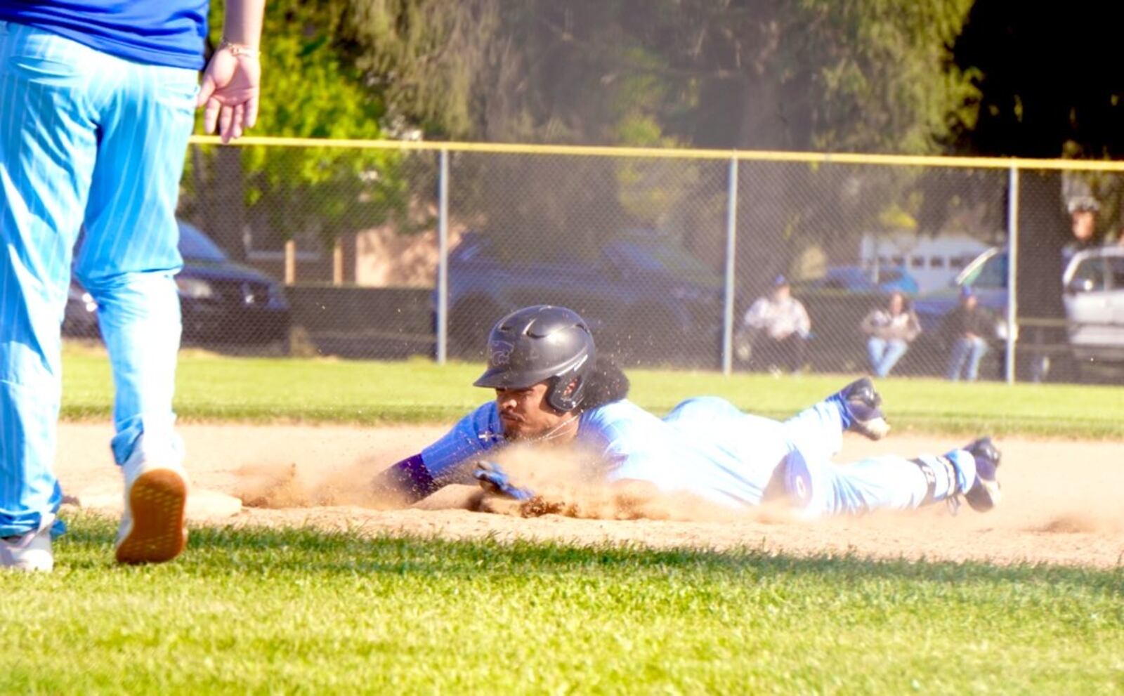 Cincinnati Christian's TJ Selvie slides into third safely against Winton Woods on Thursday at Waterworks Park. Chris Vogt/CONTRIBUTED