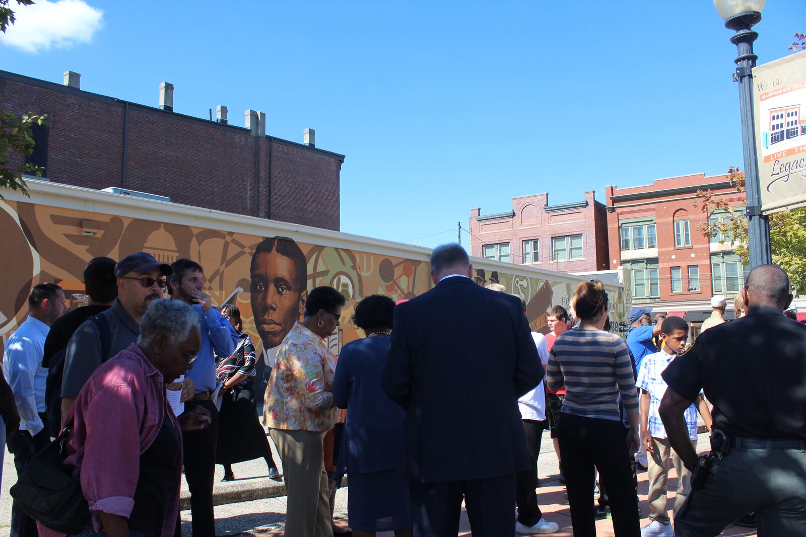 Photo from the dedication of the Dayton  Region's  Walk of Fame mural wall in  Dayton Wright-Dunbar neighborhood. The mural was designed by Dayton artist James Pate. The dedication followed the 2017 walk of fame induction ceremony.  Photo by Amelia Robinson