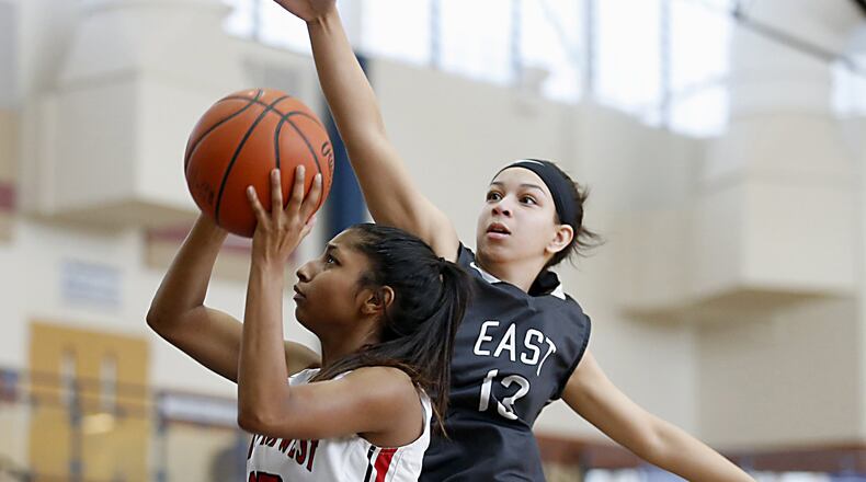 Lakota West guard Bryana Henderson heads to the basket as Lakota East guard Jordan Stanley tries to block the shot during the All-Butler County All-Star girls basketball game at the Hamilton Athletic Center on Saturday afternoon. CONTRIBUTED PHOTO BY E.L. HUBBARD