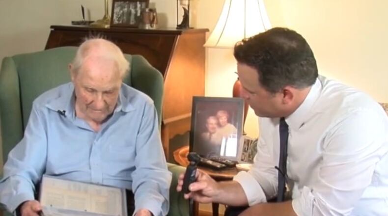 Marvin Sizemore, left, served on the USS Houston and was ultimately taken prisoner of war by the Japanese and forced to build the Burma Railway otherwise known as the 'Death Railway.' he is seen here talking to WCPO news anchor Craig McKee. WCPO/CONTRIBUTED