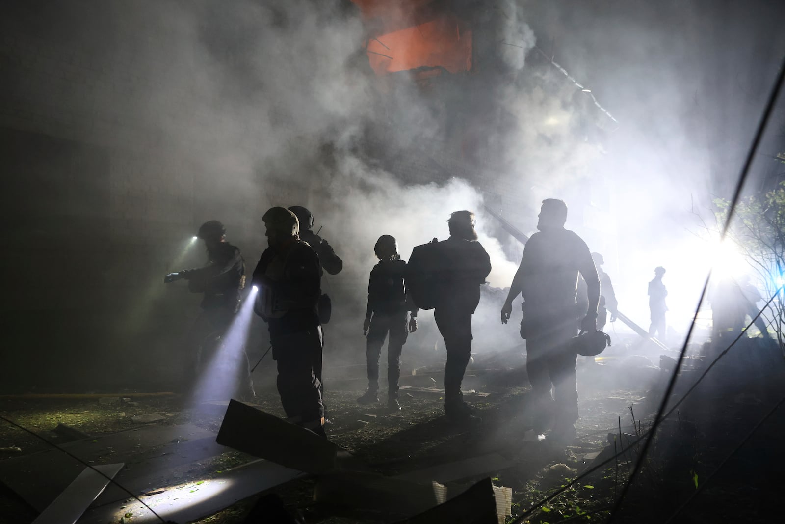 Emergency personnel work at the site of a residential building destroyed by a Russian strike in Zaporizhzhia, Ukraine, on Friday, May 1, 2025. (AP Photo/Kateryna Klochko)