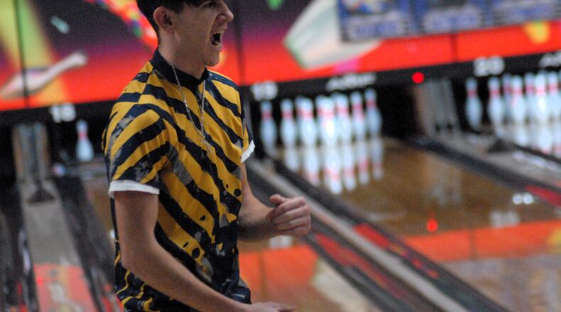 Monroe senior Trey Lambert celebrates a strike against Ross on Monday at Northwest Lanes. Lambert and the Hornets are 19-0 on the season. Chris Vogt/CONTRIBUTED