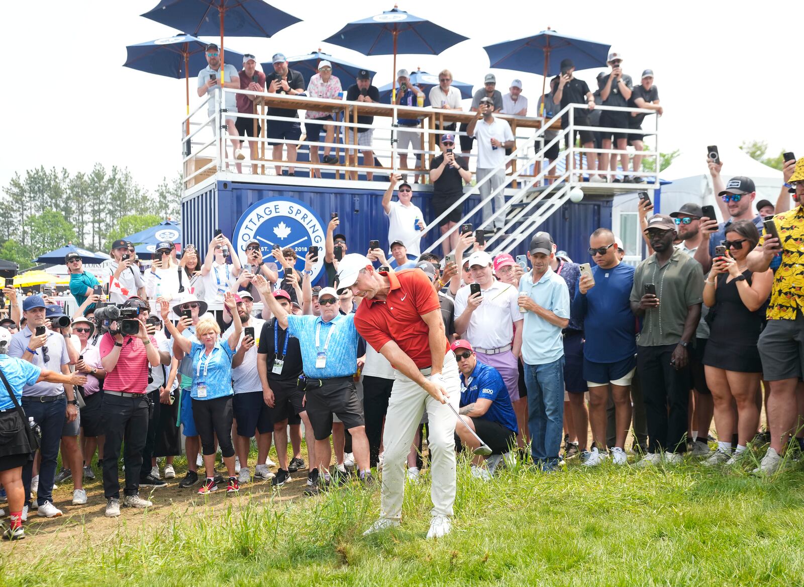 Rory McIlroy hits a chip shot from the rough on the fifth hole during the second round of the Canadian Open golf tournament in Caledon, Ontario, Friday, June 6, 2025. (Nathan Denette/The Canadian Press via AP)