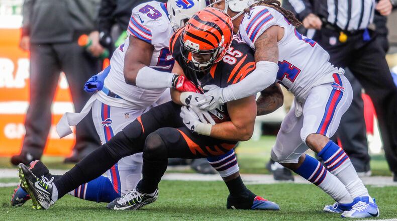 Cincinnati Bengals tight end Tyler Eifert is tackled by Buffalo Bills linebacker Zach Brown (53) and cornerback Stephon Gilmore (24) during their 16-12 loss to the Buffalo Bills Sunday, Nov. 20 at Paul Brown Stadium in Cincinnati. Woods was injured on the play. NICK GRAHAM/STAFF