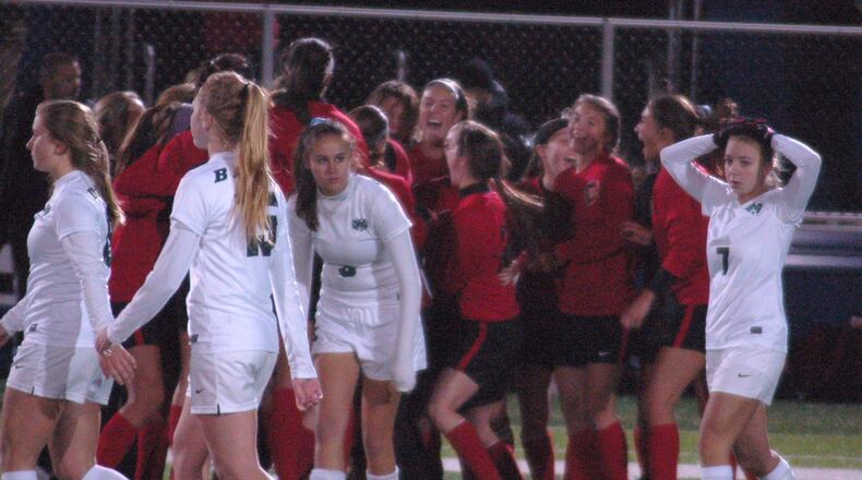 Badin’s players (in white) react as Tippecanoe celebrates a 1-0 victory in a Division II regional semifinal at Chaminade Julienne’s Roger Glass Stadium on Tuesday night. CONTRIBUTED PHOTO BY JOHN CUMMINGS
