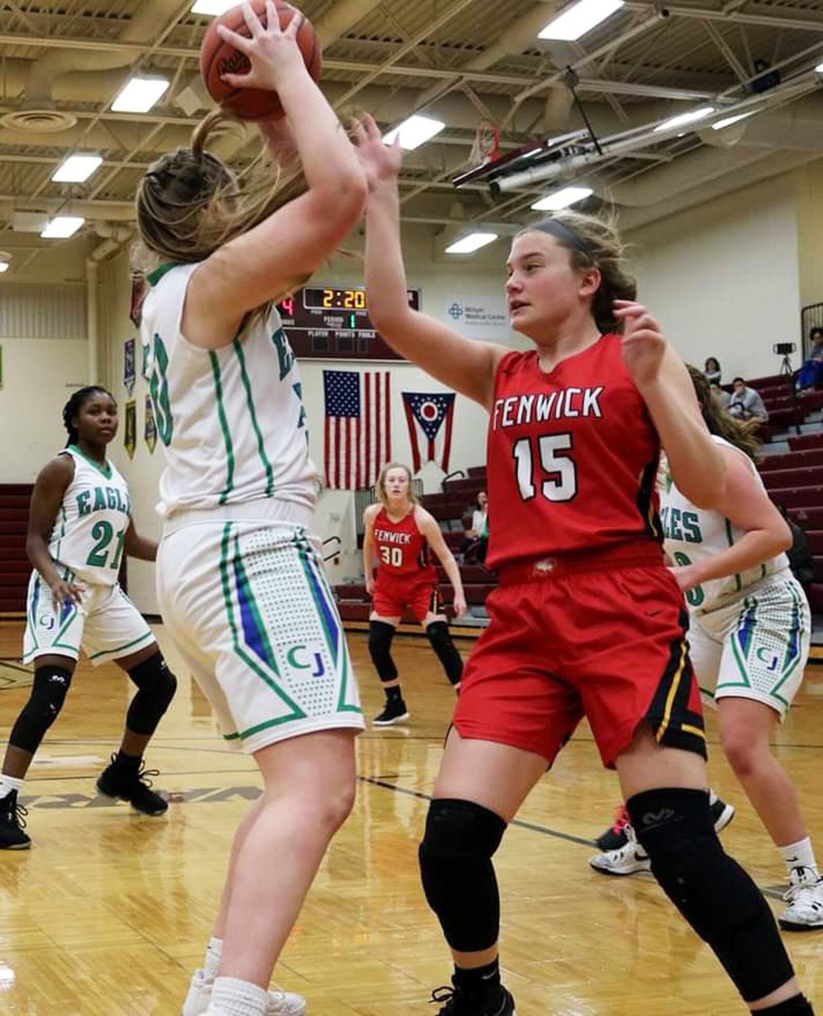 Fenwick’s Hannah Beckman (15) defends Chaminade Julienne’s Eve Monaghan (50) during Saturday afternoon’s Division II sectional opener at Lebanon. Fenwick won 38-35. CONTRIBUTED PHOTO BY TERRI ADAMS