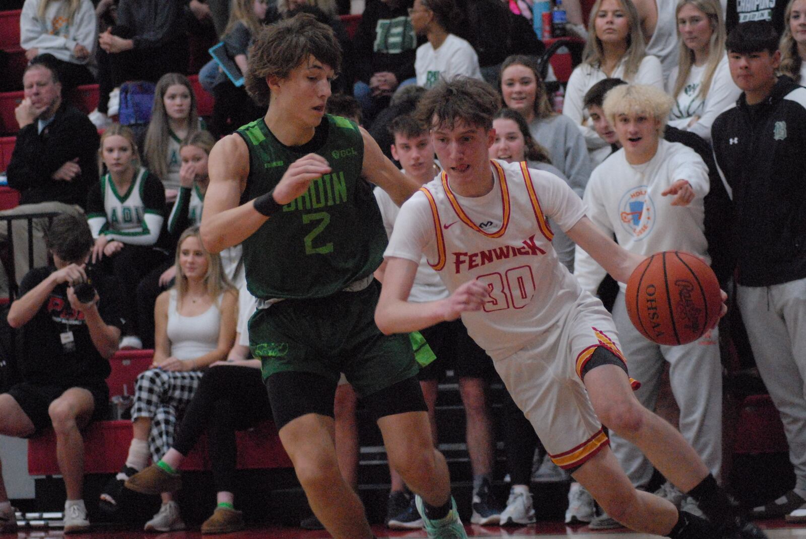 Fenwick's Eddie Ferraro (30) drives the lane against Badin's Carson Lowe (2) on Tuesday night. Chris Vogt/CONTRIBUTED