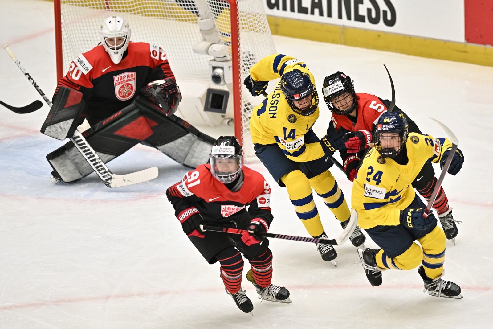 From left, goalkeeper Miyuu Masuhara of Japan, Umeka Odaira of Japan, Ida Karlsson of Sweden, Shiori Yamashita of Japan and Ebba Hedqvist of Sweden in action during the IIHF Women's World Championship, Group B, match between Japan and Sweden, in Ceske Budejovice, Czech Republic, Sunday, April 13, 2025. (Luboš Pavlíček/CTK via AP)