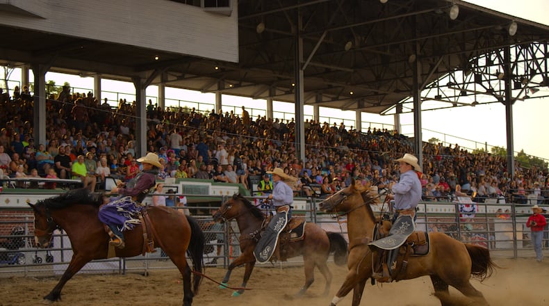 Saddle bronco riders competed at the Butler County Fair on July 23 as part of a national rodeo company. KASEY TURMAN/STAFF