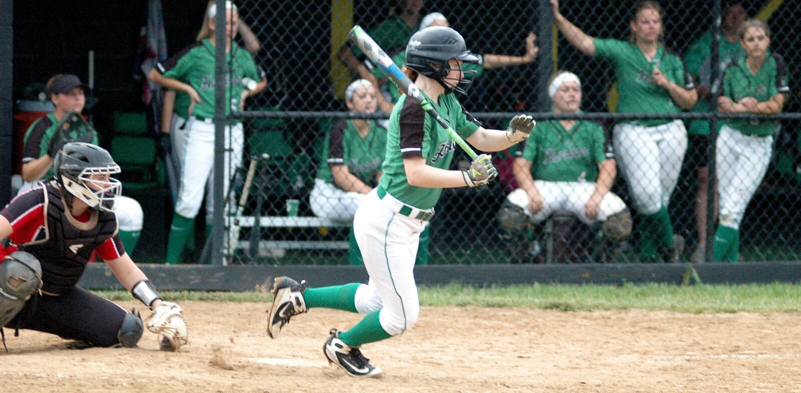 Harrison’s Lita Caruso (6) takes a swing and starts to move toward first base Wednesday during a 2-0 loss to Lakota West in a Division I regional softball semifinal at Centerville. RICK CASSANO/STAFF