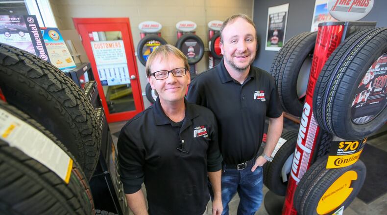 General Manager Steve Battishill and President Richie Dempster stand in the lobby of Dempter Tire Pros in Middletown on Tuesday, Nov. 22, 2016. Dempster Tire Pros is not only is celebrating 75 years in business in Middletown, it’s also expanding and has been recognized by the Chamber of Commerce Serving Middletown, Monroe & Trenton. GREG LYNCH / STAFF