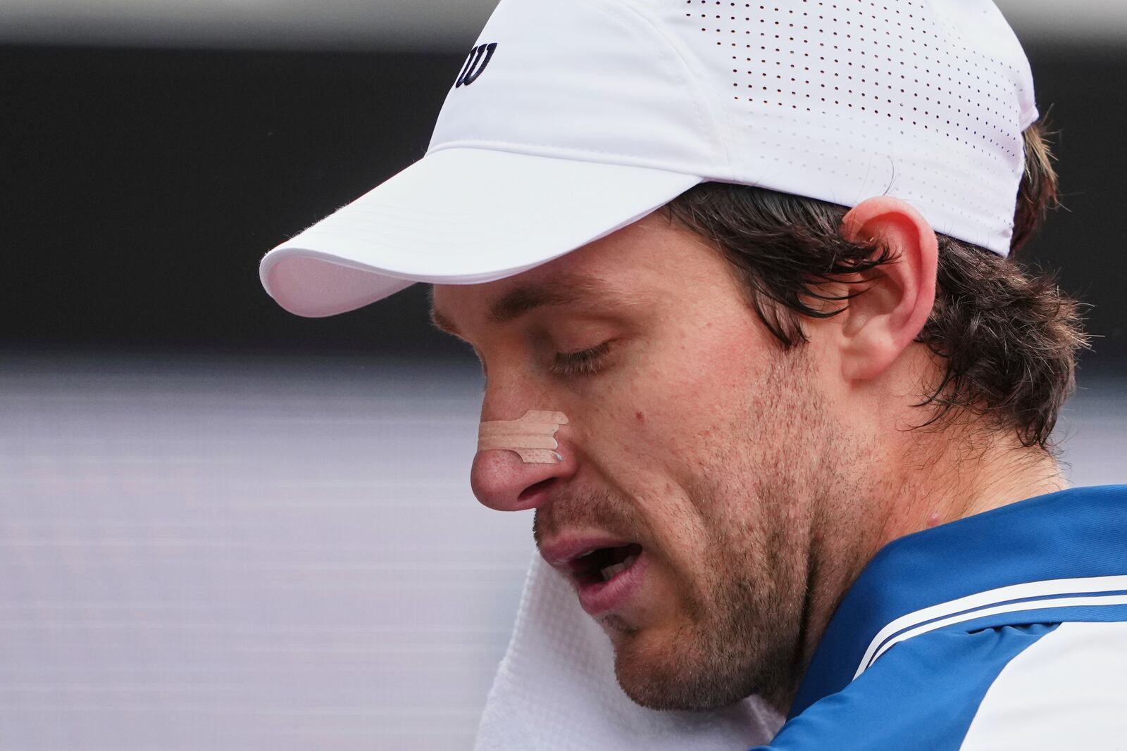 Chile's Nicolas Jarry, wearing a nasal strip, towels off as he plays France's Arthur Fils in their first round of the French Open tennis tournament at the Roland-Garros, Monday, May 26, 2025, in Paris. (AP Photo/Lindsey Wasson, File)